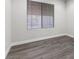 Spacious bedroom with neutral walls and wood-look floors at 350 Preston Dr, Henderson, NV 89015