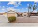 Single-story house with a beige exterior, tile roof, and a two-car garage at 350 Preston Dr, Henderson, NV 89015