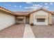 Single-story house with a beige exterior and a walkway to the entrance at 350 Preston Dr, Henderson, NV 89015