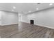 Bright living room featuring a fireplace and wood-look floors at 350 Preston Dr, Henderson, NV 89015