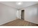 Bright bedroom with wood-look floors and mirrored closet doors at 3708 Penny Cross Dr, North Las Vegas, NV 89032