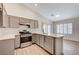 Modern kitchen with gray cabinets, stainless steel appliances and island at 3708 Penny Cross Dr, North Las Vegas, NV 89032