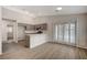 Modern kitchen with gray cabinets and a kitchen island at 3708 Penny Cross Dr, North Las Vegas, NV 89032