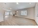 Bright living area with wood-look floors and a fireplace at 3708 Penny Cross Dr, North Las Vegas, NV 89032