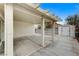 Covered patio with concrete flooring and attached storage shed at 3708 Penny Cross Dr, North Las Vegas, NV 89032