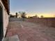 Spacious backyard with brick patio and small stepping stones at 3717 Seneca Highland St, North Las Vegas, NV 89032