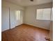 Bright bedroom with laminate flooring and double door closets at 3717 Seneca Highland St, North Las Vegas, NV 89032