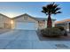 House exterior featuring a garage and driveway at 3717 Seneca Highland St, North Las Vegas, NV 89032