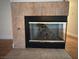 Cozy fireplace with tile surround at 3717 Seneca Highland St, North Las Vegas, NV 89032