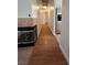 Hallway with wood floor and fireplace at 3717 Seneca Highland St, North Las Vegas, NV 89032