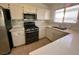 Modern kitchen with stainless appliances at 3717 Seneca Highland St, North Las Vegas, NV 89032