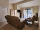 Bright living room with a sliding glass door and neutral decor at 3800 Desert Marina Dr # 160, Laughlin, NV 89029