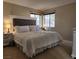 Well-lit main bedroom with a comfortable bed and windows for natural light at 3800 Desert Marina Dr # 160, Laughlin, NV 89029