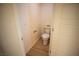 Small half bathroom with a toilet and pedestal sink at 3880 Leonard St, Pahrump, NV 89060