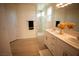 Modern bathroom with double vanity, marble shower, and light flooring at 3880 Leonard St, Pahrump, NV 89060