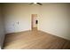 Spacious bedroom with light flooring and access to another room at 3880 Leonard St, Pahrump, NV 89060