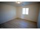 Well-lit bedroom featuring light wood flooring at 3880 Leonard St, Pahrump, NV 89060