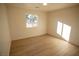 Well-lit bedroom featuring light flooring and a window at 3880 Leonard St, Pahrump, NV 89060