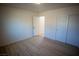 Spacious bedroom with light floors and access to bathroom at 3880 Leonard St, Pahrump, NV 89060