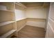 Large walk-in closet with shelving and hanging rods at 3880 Leonard St, Pahrump, NV 89060