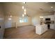 Modern kitchen with white cabinets, island, and stainless steel appliances at 3880 Leonard St, Pahrump, NV 89060