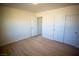 Spacious bedroom with double closets and wood-look flooring at 3960 Dart Dr, Pahrump, NV 89060