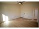 Bright and airy bedroom with light flooring and ceiling fan at 3960 Dart Dr, Pahrump, NV 89060