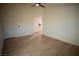 Large bedroom with light walls, wood-look floors, and access to bathroom at 3960 Dart Dr, Pahrump, NV 89060