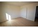 Bright bedroom with light walls and sliding closet doors at 3960 Dart Dr, Pahrump, NV 89060