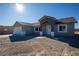 Single-story house with gray siding, tile roof, and a spacious front yard at 3960 Dart Dr, Pahrump, NV 89060