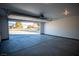 Open garage with view of driveway and distant landscape at 3960 Dart Dr, Pahrump, NV 89060