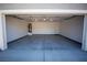 Spacious garage with white walls and an automatic garage door at 3960 Dart Dr, Pahrump, NV 89060