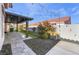 Covered patio with string lights and artificial turf at 4182 Bottiglia Ave, Las Vegas, NV 89141