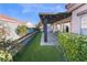 Covered patio with artificial turf and stonework at 4182 Bottiglia Ave, Las Vegas, NV 89141