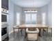 Bright dining area with large windows and modern light fixture at 4182 Bottiglia Ave, Las Vegas, NV 89141