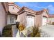 Front entry and two-car garage of a house at 4182 Bottiglia Ave, Las Vegas, NV 89141