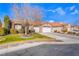 House exterior with a two-car garage and manicured lawn at 4182 Bottiglia Ave, Las Vegas, NV 89141