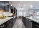 Modern kitchen with dark cabinetry, granite counters, and island at 4182 Bottiglia Ave, Las Vegas, NV 89141