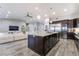 Spacious kitchen with island, stainless steel appliances, and hardwood floors at 4182 Bottiglia Ave, Las Vegas, NV 89141