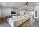 Open living area showcasing a sectional sofa, wood-look floors, and modern decor at 4182 Bottiglia Ave, Las Vegas, NV 89141