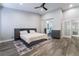 Serene main bedroom featuring a king-size bed, wood-look floors, and an ensuite bath at 4182 Bottiglia Ave, Las Vegas, NV 89141