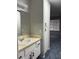 Well-lit bathroom with a spacious vanity and a view of the hallway at 4707 Nara Vista Way # 104, Las Vegas, NV 89103