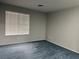Cozy bedroom with neutral walls, carpet, and a large window offering ample natural light at 4707 Nara Vista Way # 104, Las Vegas, NV 89103