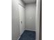 Narrow hallway showcasing a sleek white closet for optimal storage solutions at 4707 Nara Vista Way # 104, Las Vegas, NV 89103