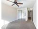 Bedroom with mirrored closet doors and ceiling fan at 4955 Lindell Rd # 119, Las Vegas, NV 89118