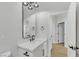 Modern bathroom with white vanity and black matte fixtures at 517 Annet St, Henderson, NV 89052