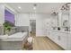 Modern bathroom with double vanity, soaking tub, and walk-in closet at 517 Annet St, Henderson, NV 89052