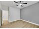 Spacious bedroom with ceiling fan and light gray accent wall at 517 Annet St, Henderson, NV 89052