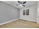 Bedroom with ceiling fan and window with shutters at 517 Annet St, Henderson, NV 89052