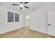 Well-lit bedroom with ceiling fan and walk-in closet at 517 Annet St, Henderson, NV 89052